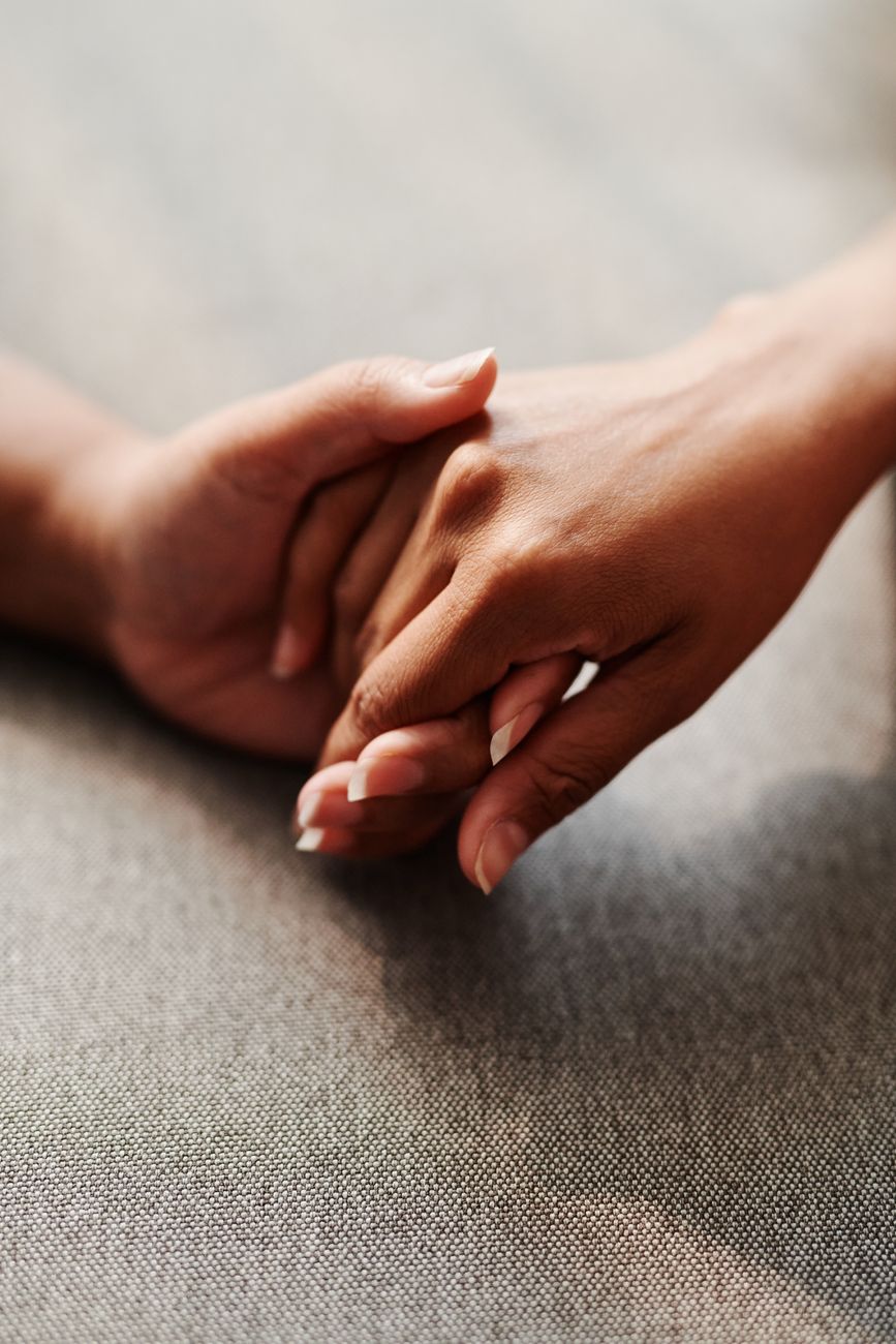 Supportive hands representing compassionate medical care